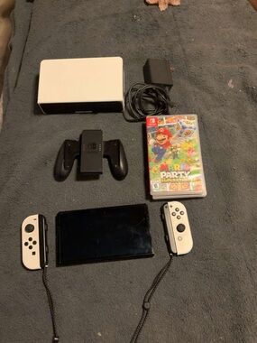 Nintendo Switch OLED with White Joy‑Con Controllers and Mario Party Superstars